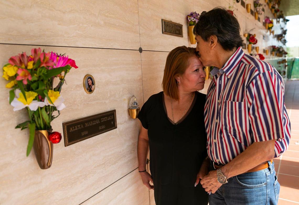 Orlando Duran and his wife, Gina Duran, embrace at their daughter’s resting place in Vista Memorial Gardens in Miami Lakes, Florida on Sunday, March 13, 2022. Alexa Duran is one of six victims who were killed outside of Florida International University when a pedestrian bridge, still underway, collapsed on March 15, 2018.