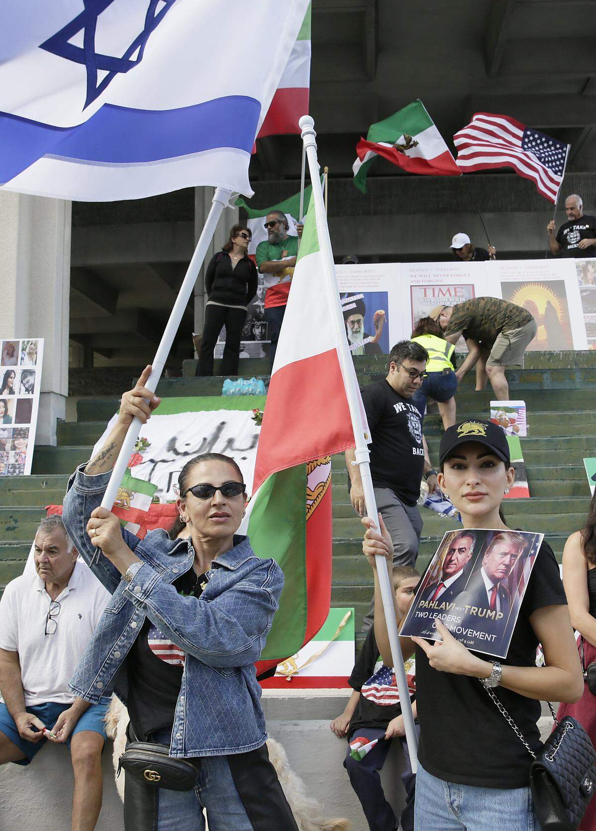 Iranian American women, Sandra Madrid (left) and Tara Nia participate in the Rally for Liberation on Sunday, March 8,2026 in Fort Lauderdale . Andrew Uloza / for Miami Herald