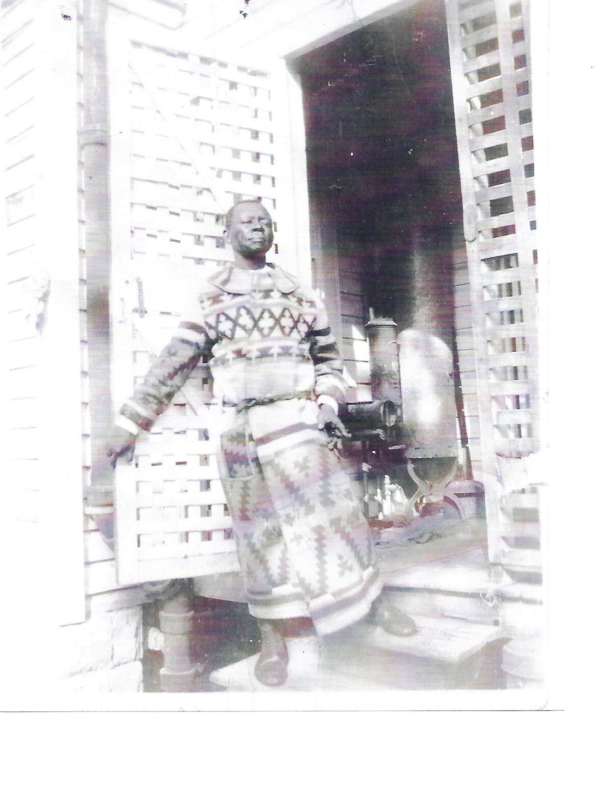 The late Dana Albert Dorsey steps out of his Overtown home in this picture from a century ago. Dorsey is considered Miami’s first African-American millionaire.
