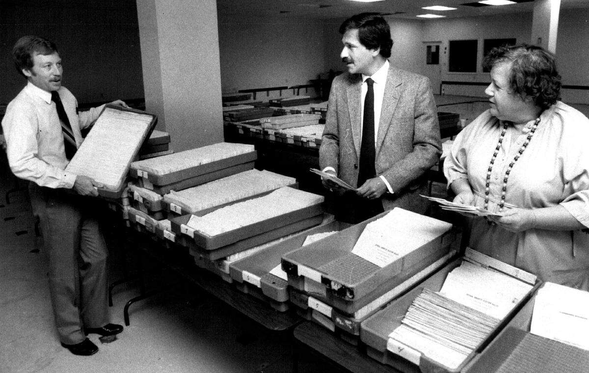 In 1984, Miami-Dade canvassing committee starts to count over 28,000 absentee ballots, with elections supervisor David Leahy, Judge Norman S. Gerstein and Commissioner Beverly Phillips