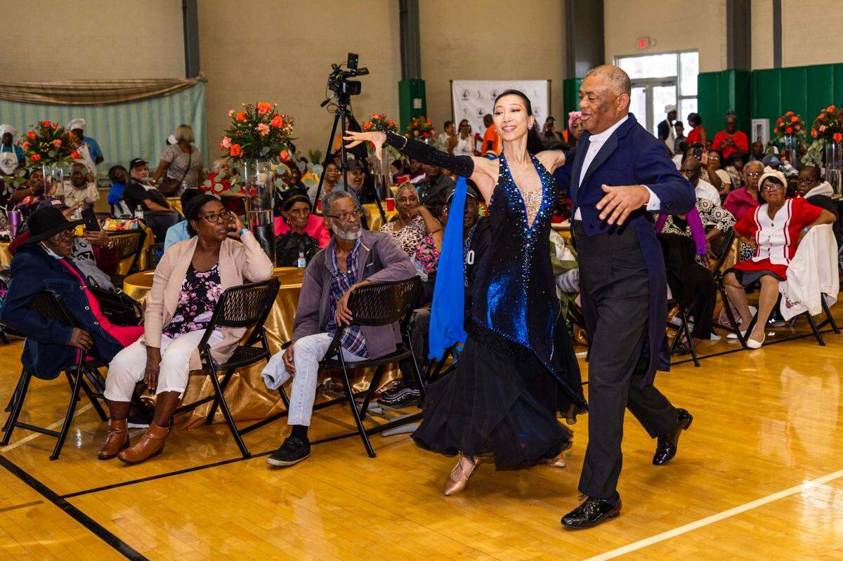 Guests watch as ballroom dancers perform