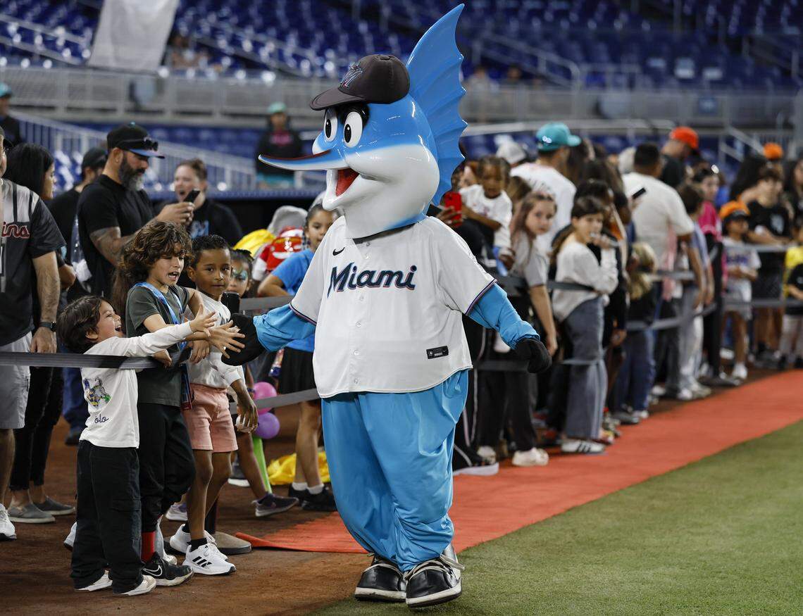 Billy the Marlin greets kids on the field during Marlins Fan Fest at loanDepot park in Miami on Saturday, February 7, 2026. 