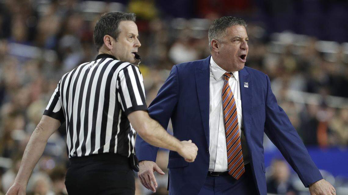 Auburn head coach Bruce Pearl, right, reacts to a call during the first half against Virginia in the semifinals of the Final Four NCAA college basketball tournament, Saturday, April 6, 2019, in Minneapolis.