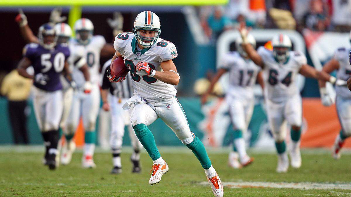 As the Miami Dolphins host the Baltimore Ravens at Dolphin Stadium on Dec. 16, 2007, receiver Greg Camarillo runs free with winning touchdown in overtime for team’s only win of season.