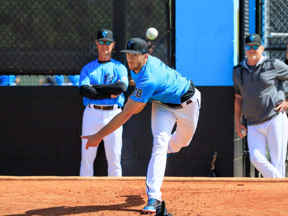 Miami Marlins manager Don Mattingly and Marlins pitching coach Mel Stottlemyre Jr look as Marlins pitcher Trevor Rogers throws during the first full-squad spring training workout at Roger Dean Stadium on Monday, March 14, 2022 in Jupiter, FL.