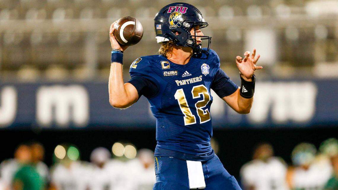 Florida International University quarterback Max Bortenschlager (12) throws a pass while pressured by UNC Charlotte 49ers defenders during the fourth quarter of an NCAA Conference USA football game at Riccardo Silva Stadium in Miami, Florida, on Friday, October 8, 2021.