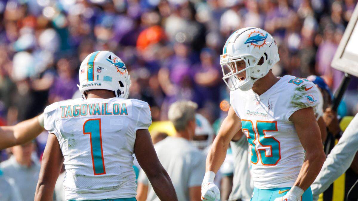 Miami Dolphins quarterback Tua Tagovailoa (1) celebrates with wide receiver River Cracraft (85) after Tyreek Hill (10) scoring the touchdown to tie the game during fourth quarter of an NFL football game against the Baltimore Ravens at M&T Bank Stadium on Sunday, September 18, 2022 in Baltimore, MD.