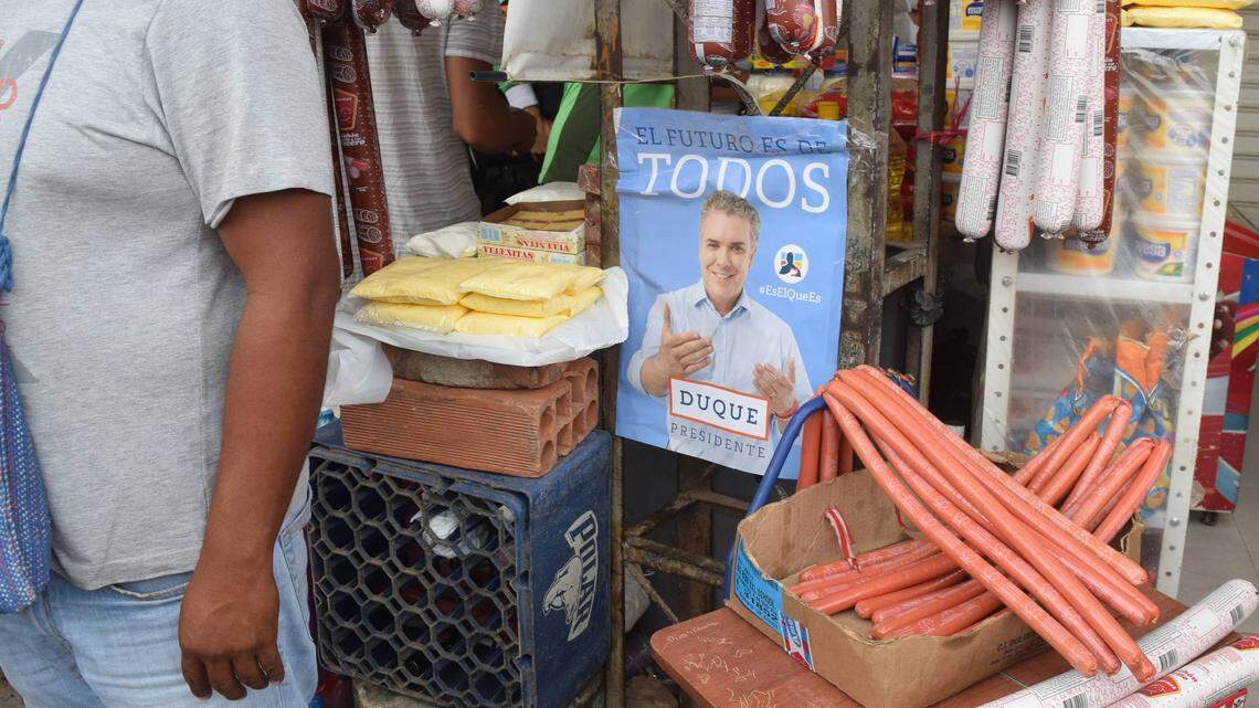 Colombian presidential candidate Ivan Duque has seen some of his staunchest support along the border with Venezuela. Here, one of his campaign posters hangs at a stand at the foot of the Simón Bolívar international bridge connecting the two countries.