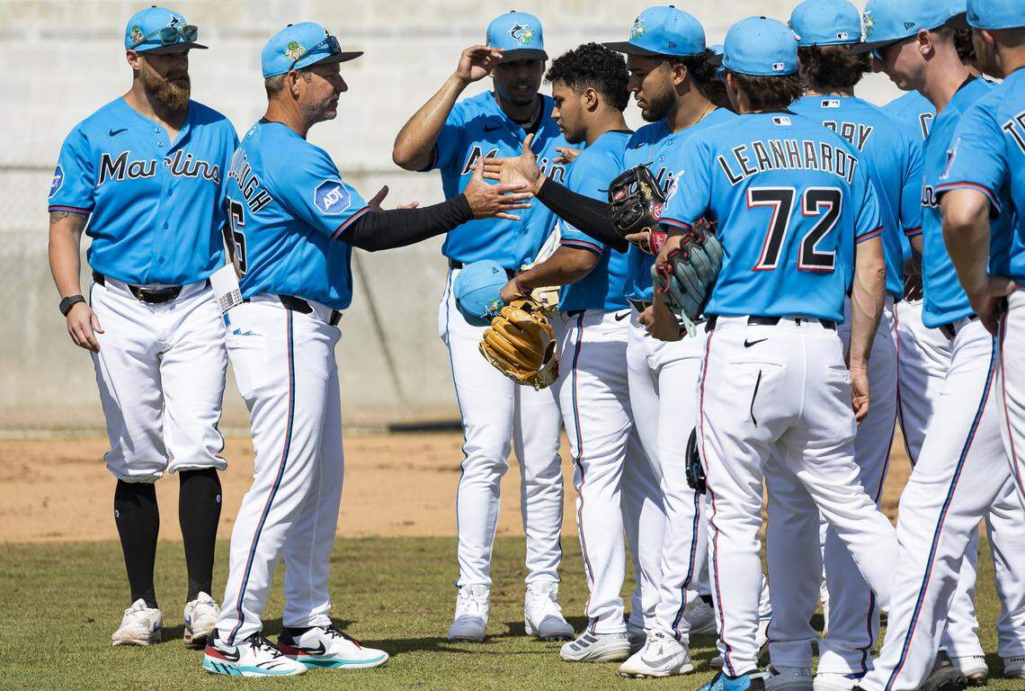 Miami Marlins manager Clayton McCullough (86) talks with players during the team's first full-squad spring training workout at Roger Dean Stadium on Monday, Feb. 16, 2026, in Jupiter, Fla.
