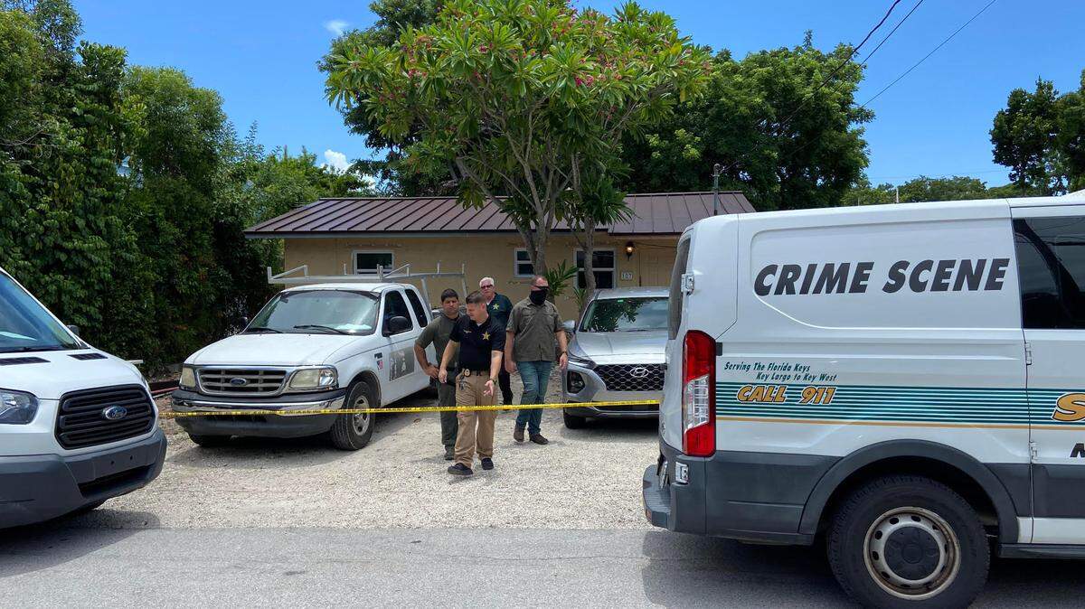 Monroe County Sheriff’s Office detectives leave a house on Pacific Avenue in the Upper Keys community of Tavernier Thursday, Aug. 4, 2022. A man was stabbed to death inside the house earlier that day.