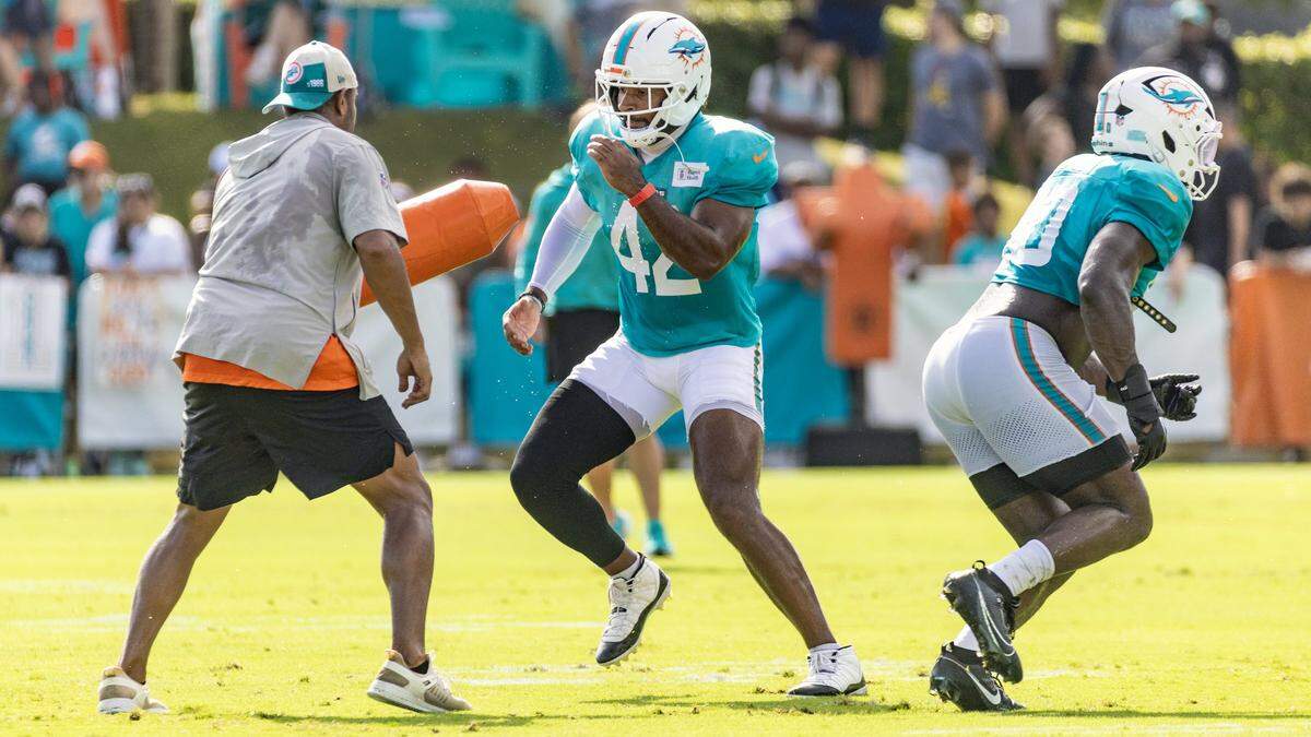 Miami Dolphins linebacker Grayson Murphy (42) runs through drills during practice at the Miami Dolphins Training Camp.