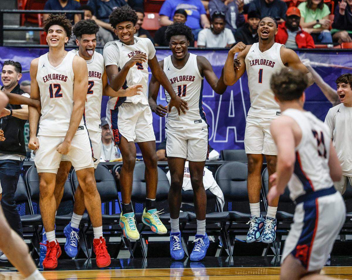 Columbus’ Cameron Boozer (12), Cayden Boozer (2), Jaxon Richardson (5), Caleb Gaskins (11) and Cello Jackson (1) celebrate after a score late in the game against Windermere in the FHSAA Class 7A Final for Boys High School Basketball State Championship