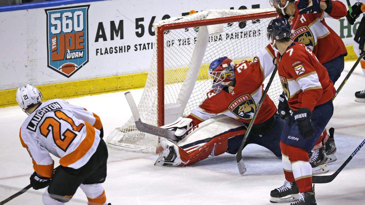 Florida Panthers goalie Sam Montembeault (33) is unable to stop a shot by Philadelphia Flyers center Scott Laughton (21) during the second period of an NHL regular season hockey game at the BB&T Center on Thursday, February 13, 2020 in Sunrise.