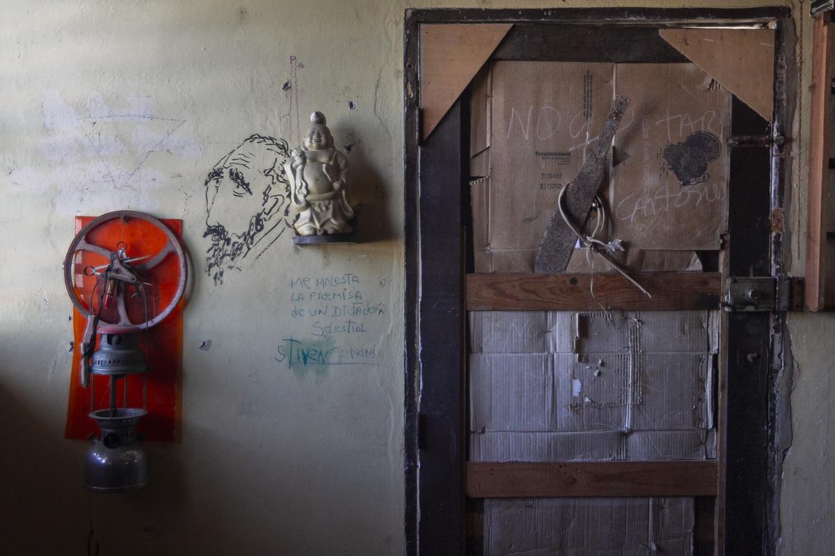 Some of artist Jorge Alberto Hernandez Cadi’s works are displayed on his front door. He is known as “El Buzo” (the diver) because he scavenges through the trash to find objects for his art.