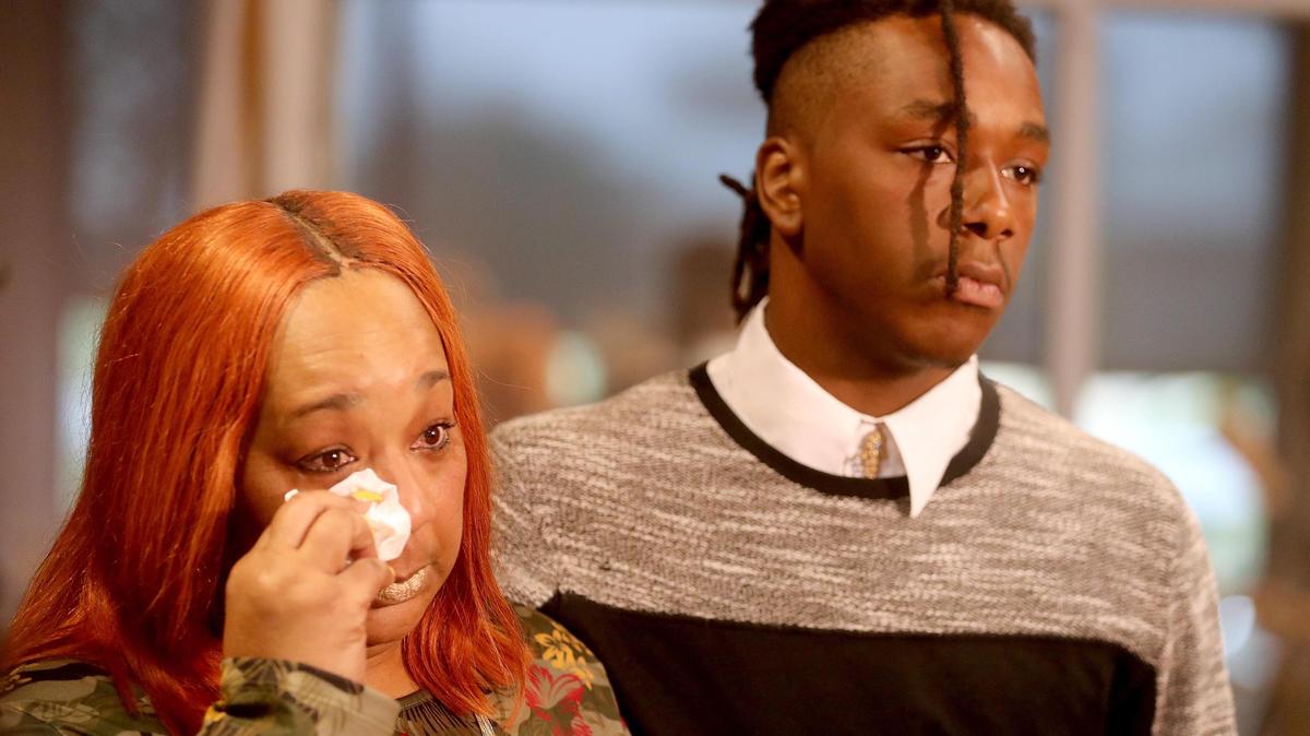 Angela Cross and her son Cyrus Nance talk with the media during a press conference to discuss a potential case against American Heritage High school for allegedly discriminating against Nance and expelling him without due process.