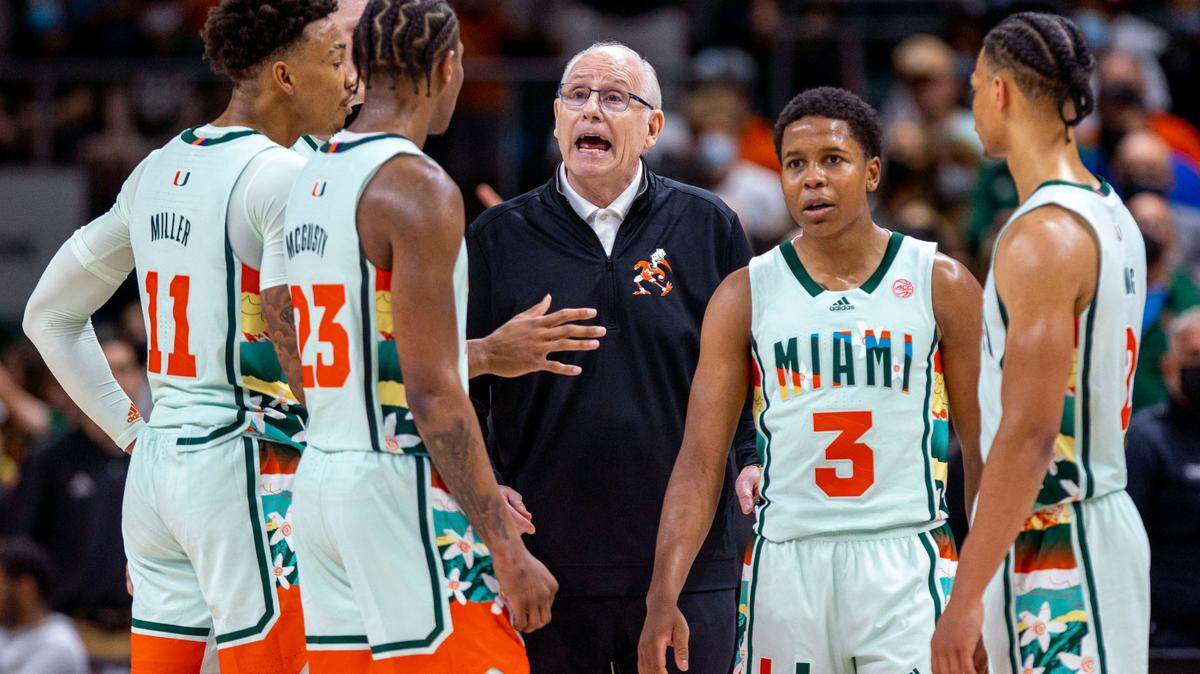 University of Miami Head Coach Jim Larranaga speaks with his players during the second half of an NCAA basketball game against Virginia Tech at the Watsco Center in Coral Gables, Florida, on Saturday, February 26, 2022.