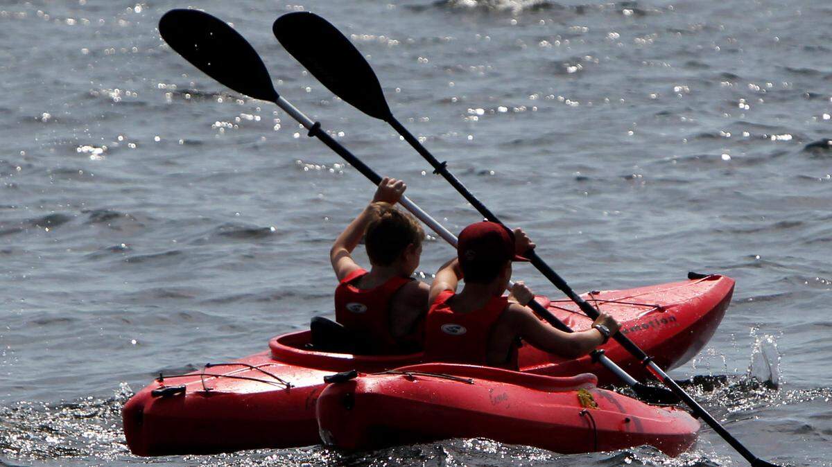 In this stock photo, a pair of campers enjoy a kayak trip on Lake Champlain at Camp Abnaki on Friday, July 6, 2012. A COVID-19 outbreak shut down the camp on Aug. 12, 2022.