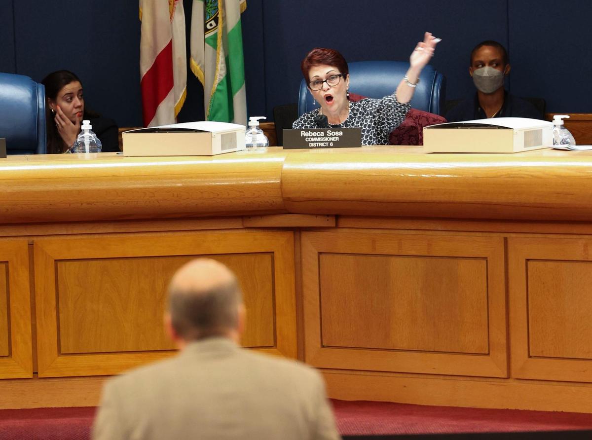 Commissioner Rebeca Sosa throws her hands up during questioning in a meeting prior to a vote on expanding the Urban Development Boundary before the Miami-Dade County Commission on Thursday, May 19, 2022, at the Stephen P Clark Center in Miami. Without the support to move the UDB on the board, developers secured a deferral until the commission’s June 1 meeting.