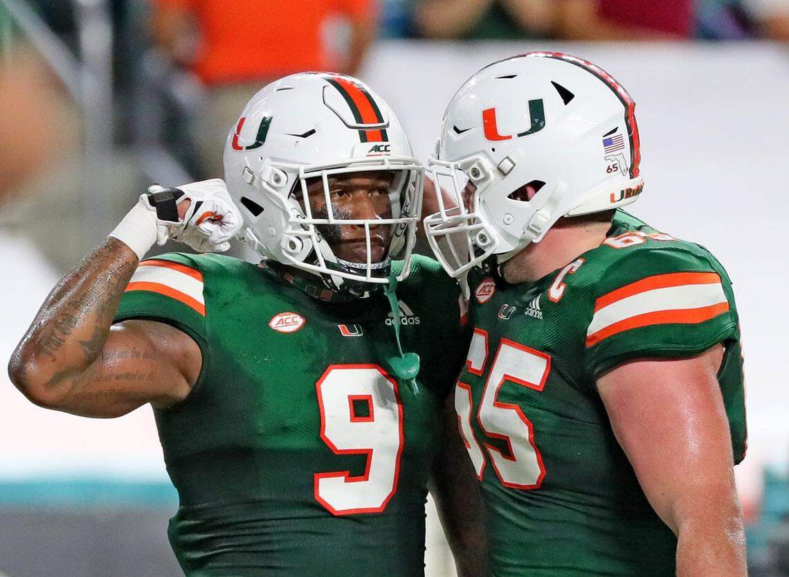 UM’s tight end Brevin Jordan (9) flexes after scoring a first quarter touchdown with offensive linemen Corey Gaynor (65) as the University of Miami host Florida State University Seminoles at Hardrock Stadium in Miami Gardens on Saturday, September 26, 2020.