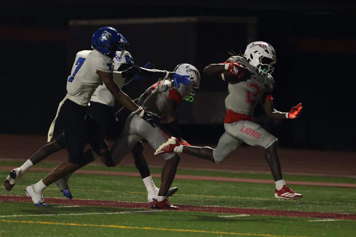 Chaminade-Madonna Lions running back Arwin Jackson (2) carries the football for a touchdown against Trinity Christian Academy during the second half of a Class 1A football state semifinal game at Chaminade-Madonna College Preparatory on Friday, Dec. 5, 2025 in Hollywood, Fla.