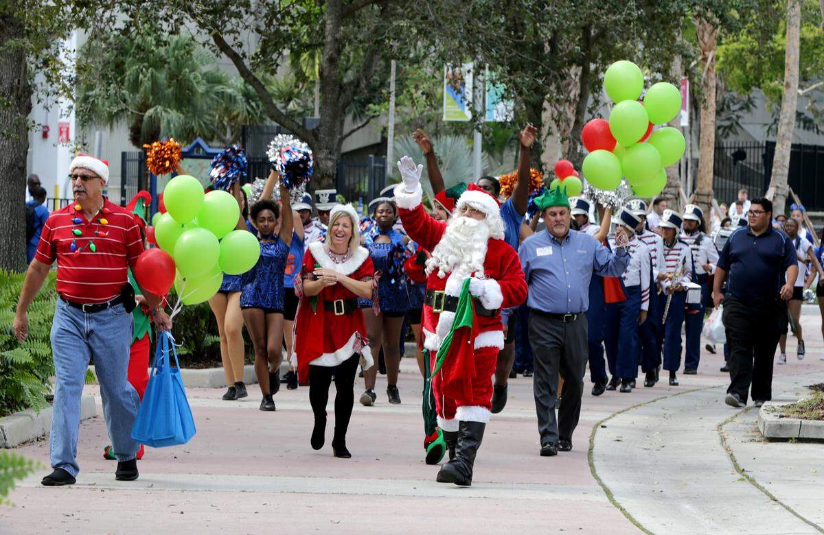 Santa Claus greets young patients and visitors on Dec. 4 at Holtz Children’s Hospital and Jackson Memorial Hospital during a parade accompanied by the marching band from Hialeah-Miami Lakes High School performing holiday favorites.