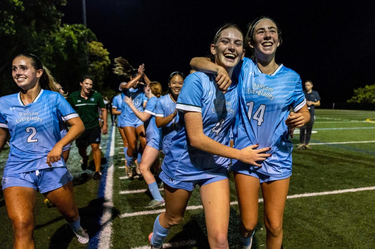 From left to right, Ransom Everglades teammates Avery Almazan (2), Kenzie Connell (4), and Lina Grunwald (14) react after defeating Palmer Trinity 4-3 during the girls soccer 4-2A Regional Final on Wednesday, February 19, 2025, in Coconut Grove, Florida.