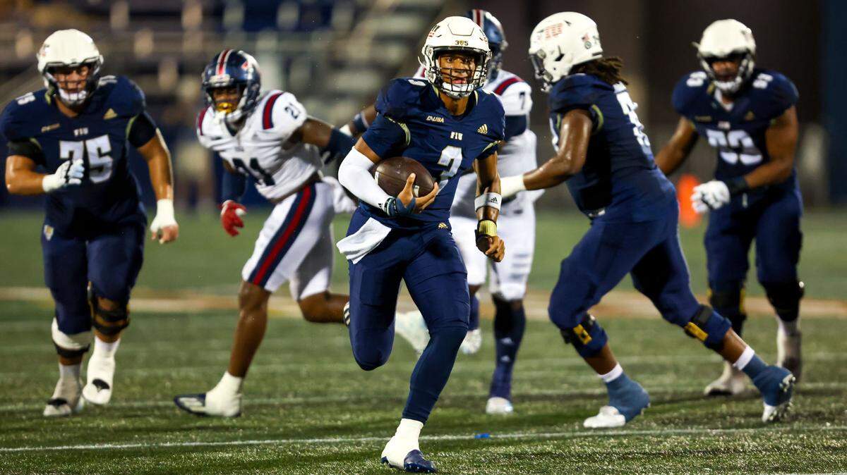 FIU quarterback Grayson James (3) runs on a keeper to score a touchdown during the first half of the Shula Bowl gainst FAU at Riccardo Silva Stadium in Miami, Florida, on Saturday, November 12, 2022.