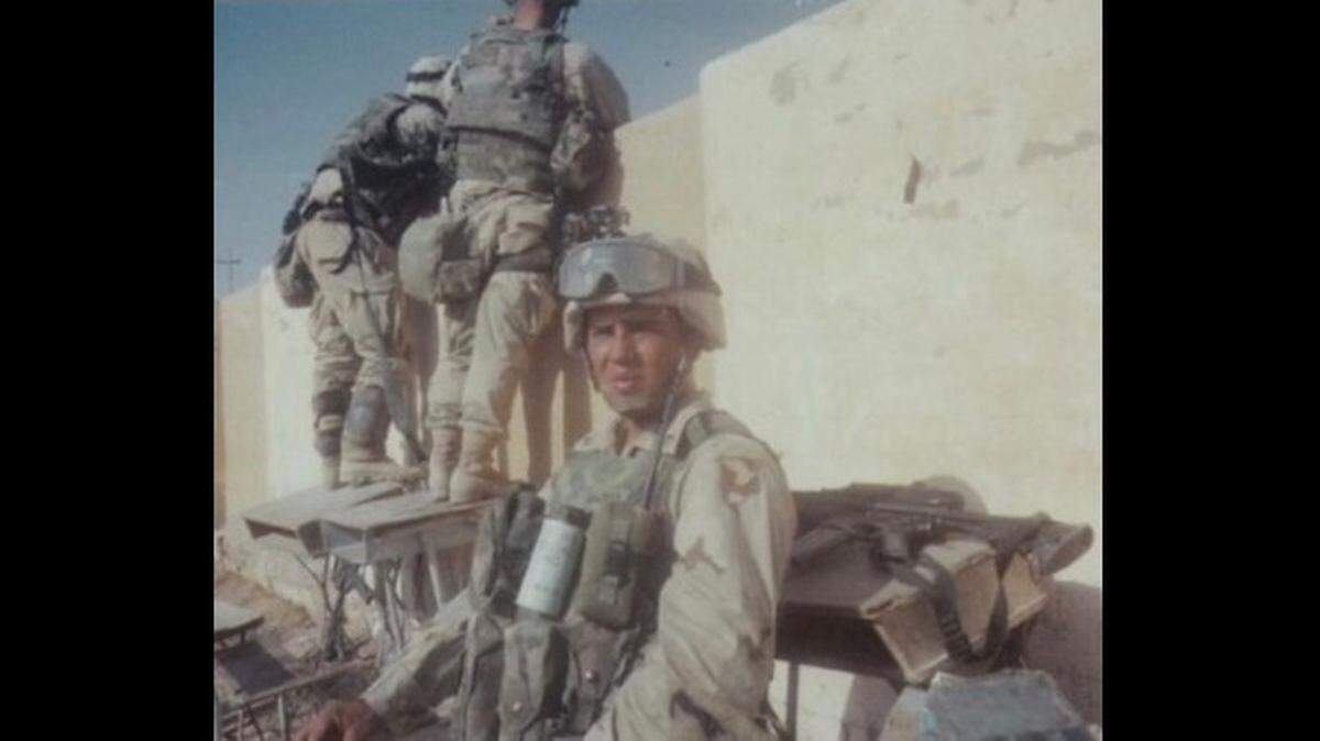 This photo from March 2003 shows Ahmed Madriz and two of his fellow solders securing a location in Najaf, Iraq as their unit pushed north toward Baghdad.