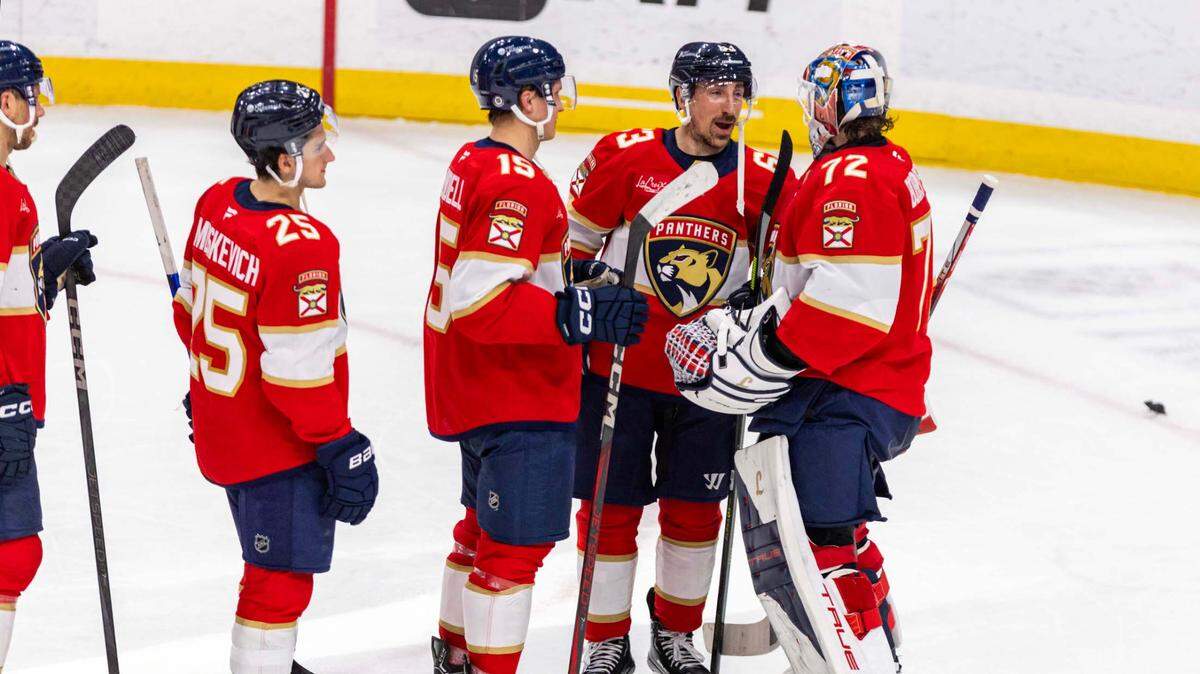Florida Panthers center Brad Marchand (63) reacts with goaltender Sergei Bobrovsky (72) after defeating the Detroit Red Wings 4-1 during the third period of an NHL game at Amerant Bank Arena on Thursday, April 10, 2025, in Sunrise, Fla.