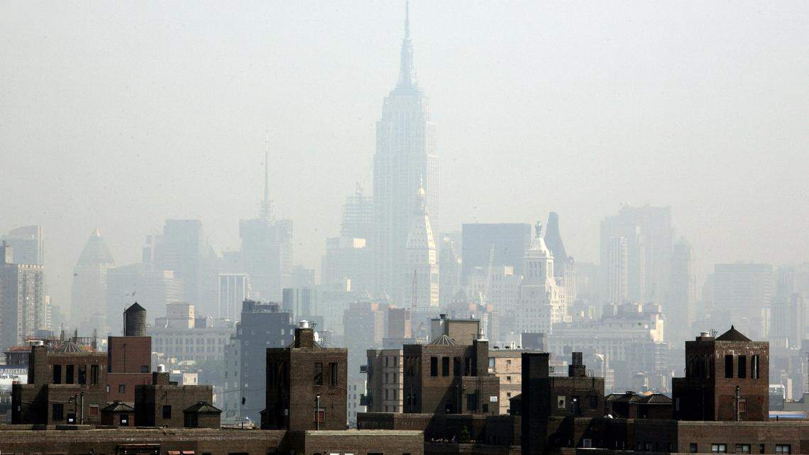 Smog covers midtown Manhattan in New York on Tuesday, July 10, 2007. Hospitalized COVID-19 patients who had been chronically exposed in their neighborhoods to higher particulate matter — such as smoke, soot, and dirt — had increased risks for admission to the intensive care unit and death compared to those without such exposure, Mount Sinai researchers found.