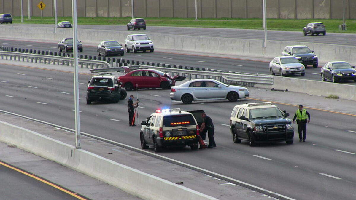 The aftermath of the Aug. 18 crash on I-75. Two women died in the red Toyota Yaris.