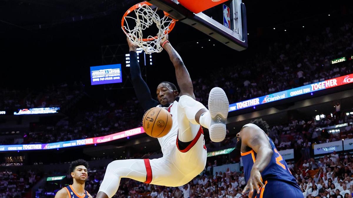 Miami Heat center Bam Adebayo (13) dunks against New York Knicks Mitchell Robinson (23) during the first quarter Game 6 of the Eastern Conference second-round playoff series at the Kaseya Center in Miami on Friday, May 12, 2023.