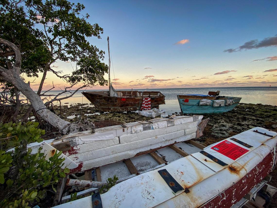 Boats used by Cuban migrants to reach the United States sit off shore at Harry Harris Park in Tavernier, Florida Keys, on Jan. 14, 2023.