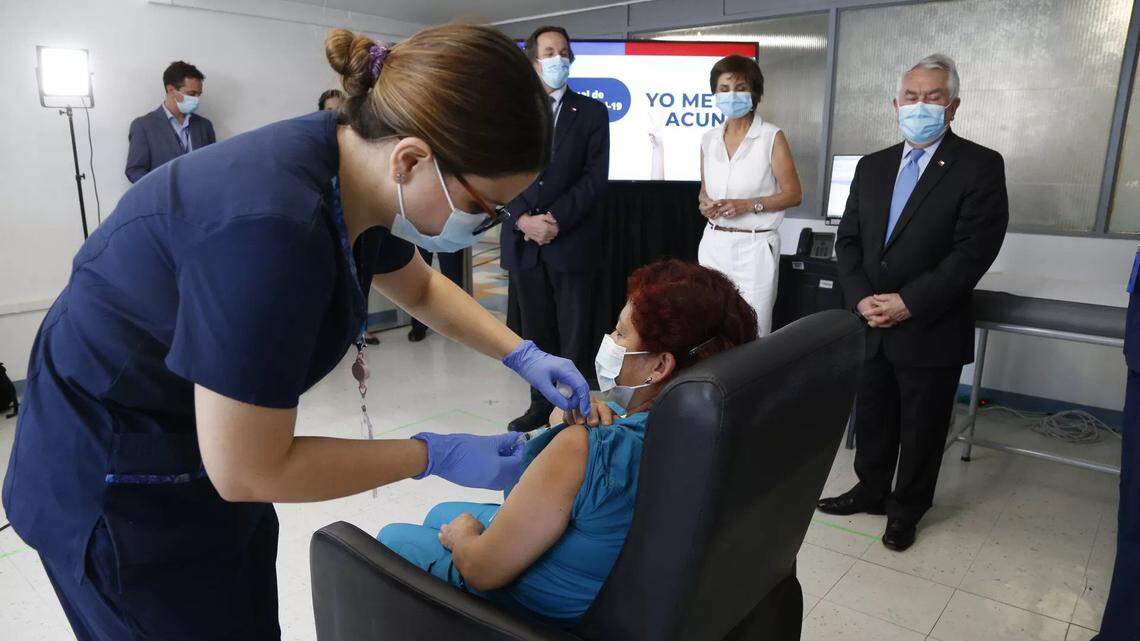 A nurse receives the Pfizer-BioNTech vaccine in Santiago, Chile.