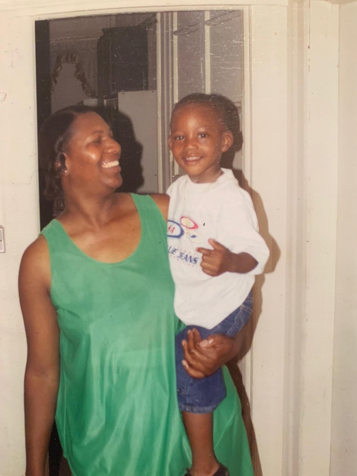 A photo of Miami Heat center Bam Adebayo, as a kid, with his mother Marilyn Blount.