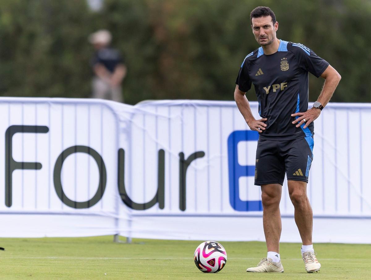 Argentina head coach Lionel Scaloni looks on as his players prepare to run drills.