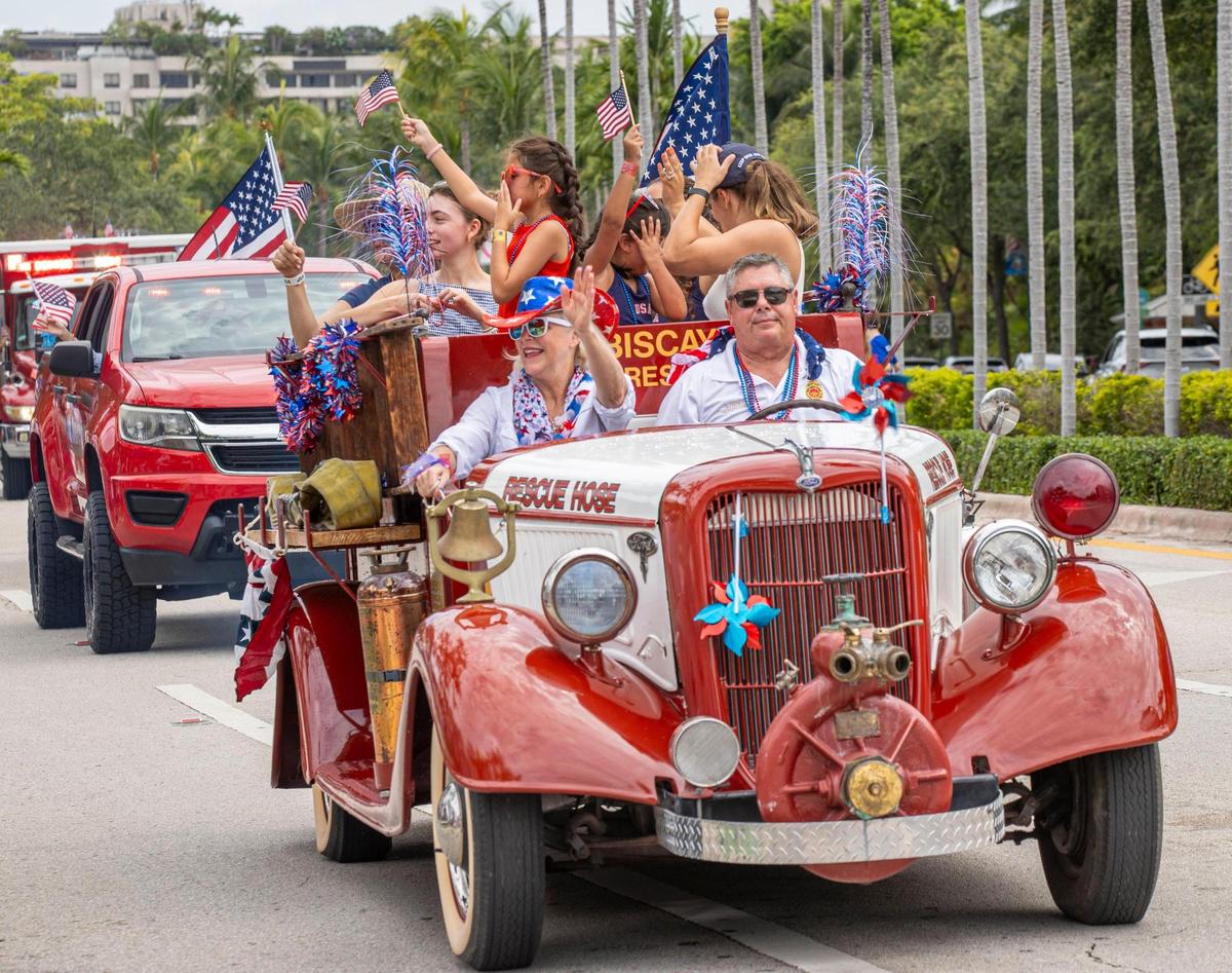 The Fire Rescue vehicle celebrates Independence Day with parade attendees on Friday, July 4, 2025, in Key Biscayne, Fla.
