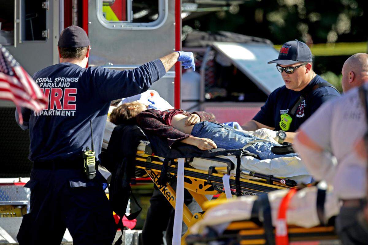 Medical personnel tend to a victim outside of Marjory Stoneman Douglas High School in Parkland after Nikolas Cruz shot 32 people on Feb. 14. Seventeen of them died.