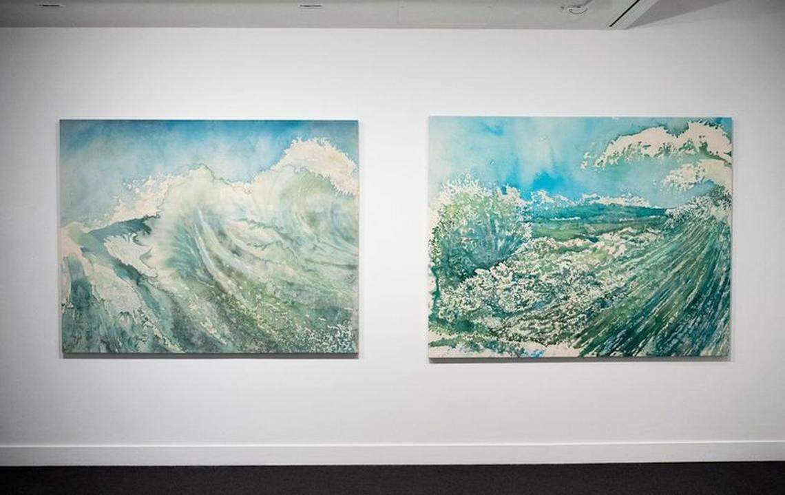 Paintings of crashing waves hang in the NSU Art Museum.