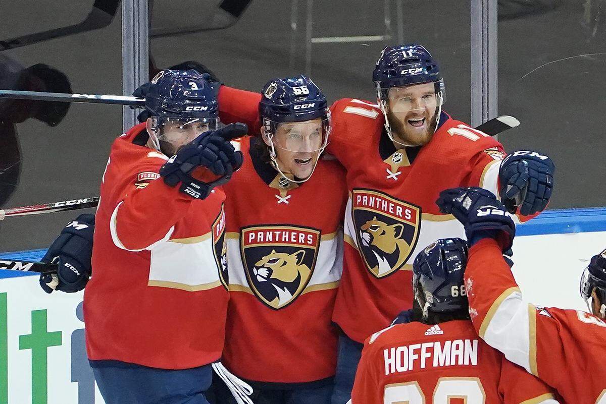 TORONTO, ONTARIO - AUGUST 05: Erik Haula #56 of the Florida Panthers (C) celebrates his power-play goal at 4:02 of the second period against the New York Islanders in Game Three of the Eastern Conference Qualification Round prior to the 2020 NHL Stanley Cup Playoffs at Scotiabank Arena on August 5, 2020 in Toronto, Ontario, Canada. (Photo by Andre Ringuette/Freestyle Photo/Getty Images)