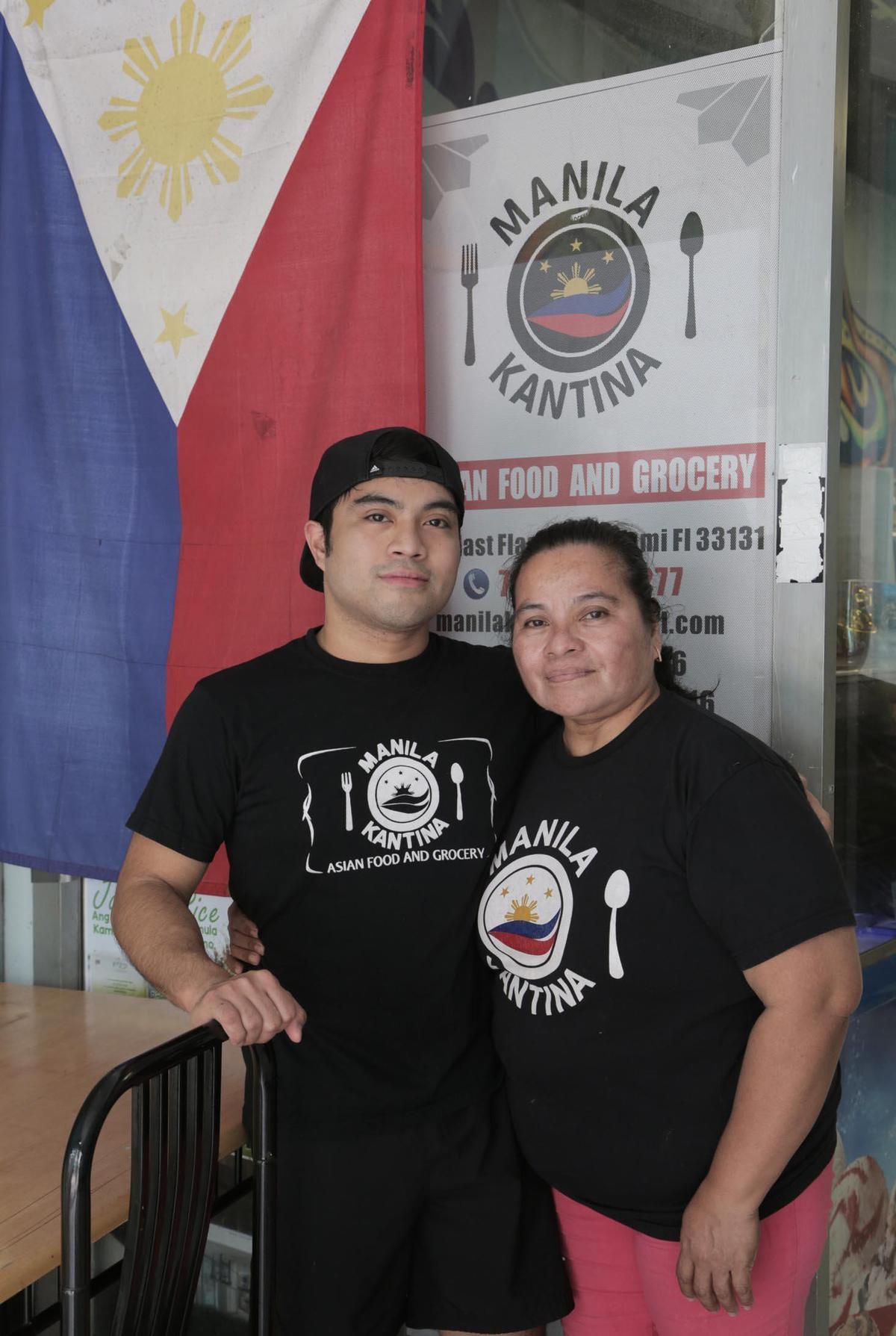 Judith Blasco, owner of Manila Kantina (right), and her son Petronio Blasco III (left) stand outside their restaurant Manila Kantina in downtown Miami on June 11, 2020.