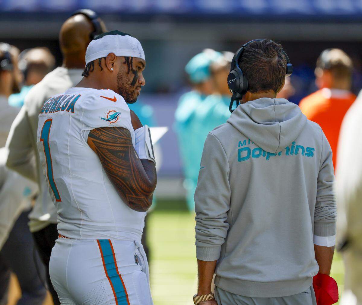 Miami Dolphins quarterback Tua Tagovailoa (1) talks with Miami Dolphins head coach Mike McDaniel during the first half of an NFL game against the Indianapolis Colts at Lucas Oil Stadium on Sunday, September 7, 2025, in Indianapolis, Indiana.