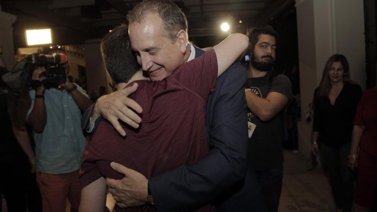 Republican Rep. Mario Diaz-Balart hugs his son Cristian during a victory party at the Flamingo Terrace at Hialeah Park, 100 E. 32nd St., in Hialeah.  Diaz-Balart cruised to victory Nov. 6, 2018, over Democrat Mary Barzee Flores to retain his seat representing Florida’s 25th Congressional District.