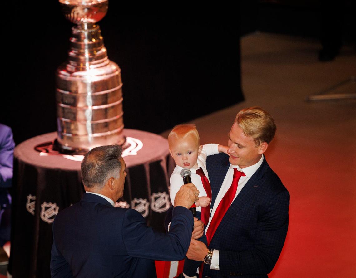 Gustav Forsling and his baby son Bo, right, receive his ring from Vincent Viola, owner of the Florida Panthers, during the Florida Panthers 2024 Champions Ring Ceremony on Monday, Oct. 7, 2024, at FTL War Memorial Auditorium in Fort Lauderdale, Fla.