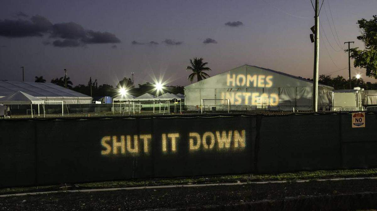 In March, protesters projected phrases such as “Shut It Down” and “Homes Instead” from across the street onto the shelter for unaccompanied minors in Homestead,
