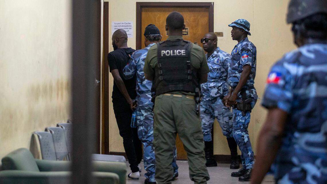 In this Jan. 25, 2021, file photo, Arnel Joseph is returned to the National Penitentiary after being brought before a judge in handcuffs in Port-au-Prince, Haiti. Authorities say Joseph, whom they describe as one of Haiti’s most powerful gang leaders, was shot Friday, Feb. 26, a day after he and dozens of other inmates escaped from prison during a breakout that left at least eight people dead, including the prison director.