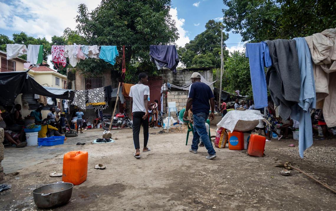 People go about their day at a displacement camping Leogane, Haiti. People have no tarps and say they are forced to sleep in the dirt after armed gangs forced them from their homes in the communities of Carrefour and Gressier.