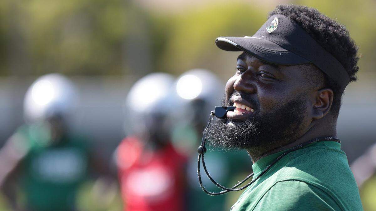 On Wednesday, August 3, 2022 Miami Central High new head coach Jube Joseph conducts looks over the team as he conducts practice at Miami Central High practice field.