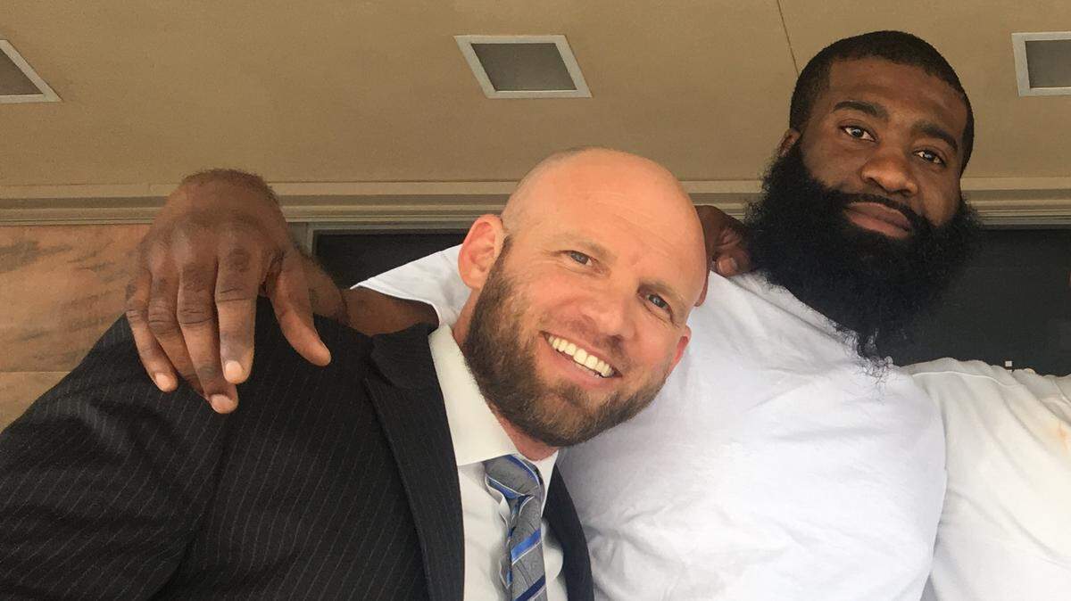 Garry Garcon, right, and his defense lawyer Jonathan Jordan on the steps of Miami-Dade’s courthouse after he was cleared of a murder charge by a judge.