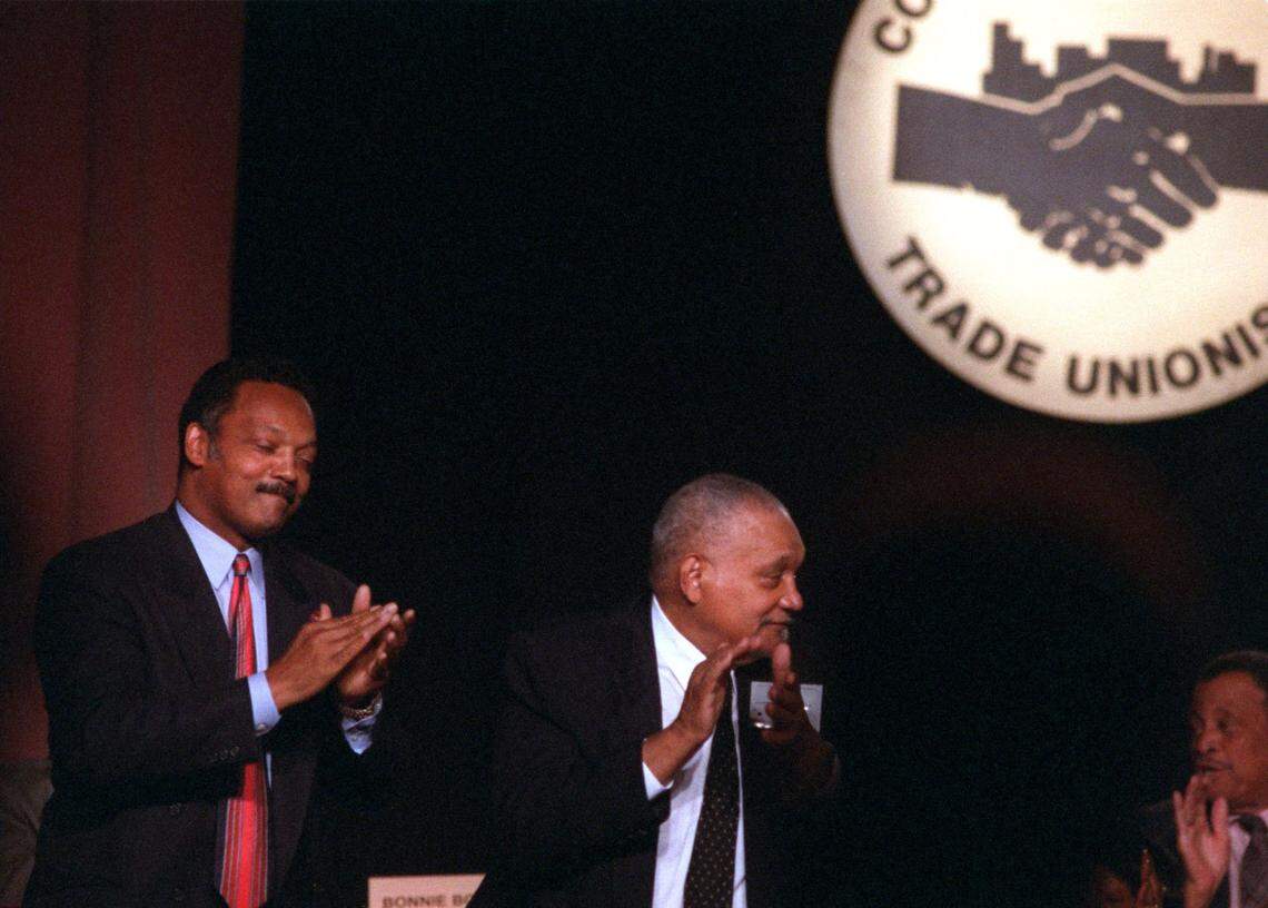 In 1996, Vice President Al Gore speaks to the annual Convention of The Coalition of Black Trade Unionists at the Fontainebleau in Miami Beach as the Rev. Jesse Jackson and Charles Hayes, former congressman from Detriot, applaud.